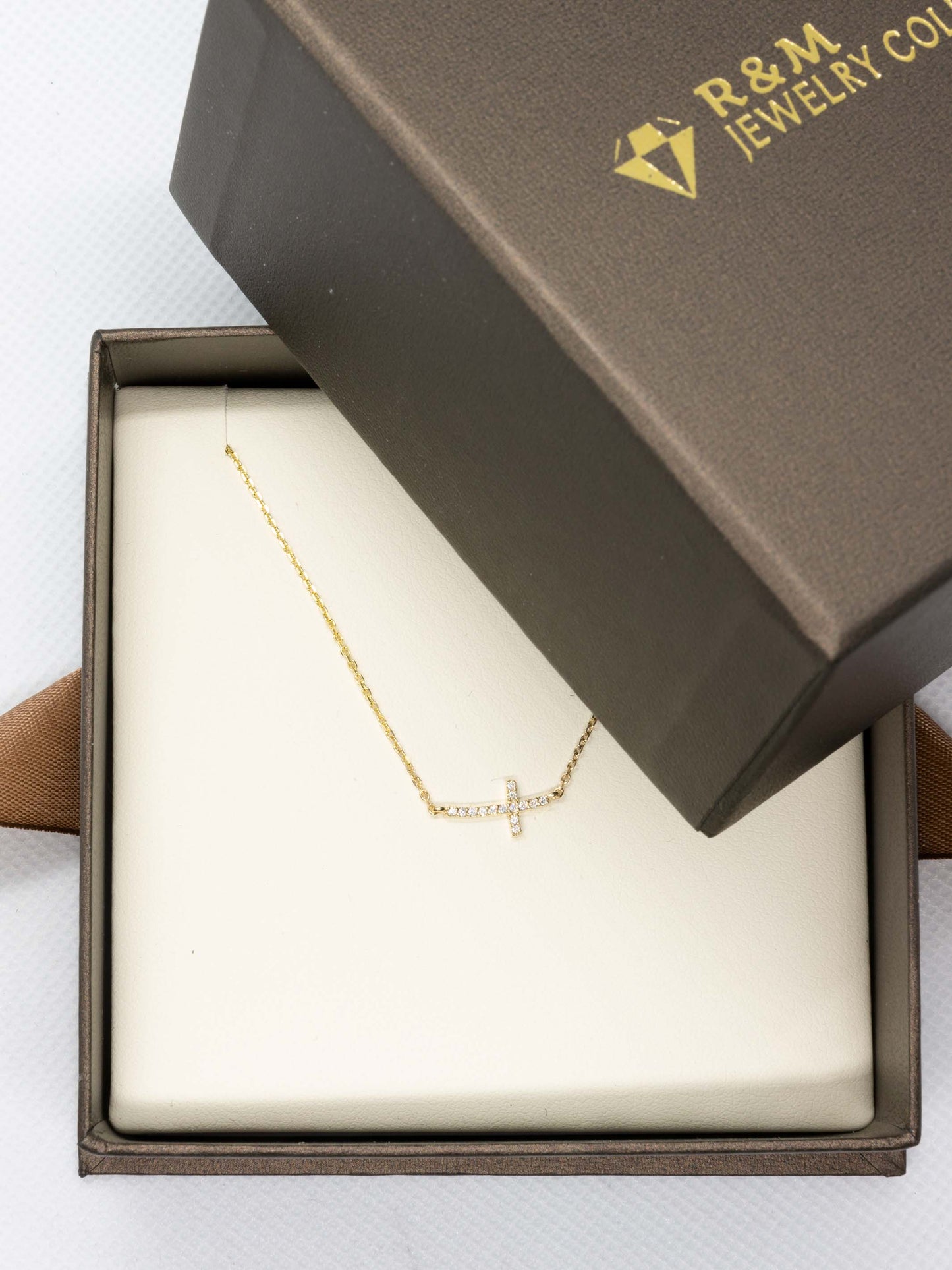 16'-18' Adjustable Mini Sideways Cross Necklace in 14k Yellow Gold